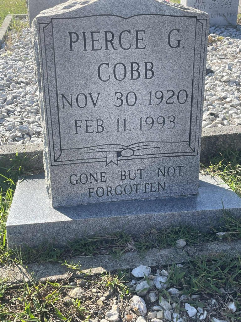 Headstone of Pierce Cobb. Engraving reads Born 30 November 1920 . Died 11 Feb 1993. Gone but not forgotten.