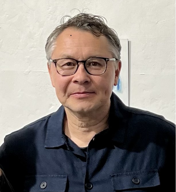 Headshot of Allan O'Neill wearing glasses and smiling at the camera