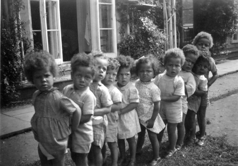 Children in a queue at Holnicote House.