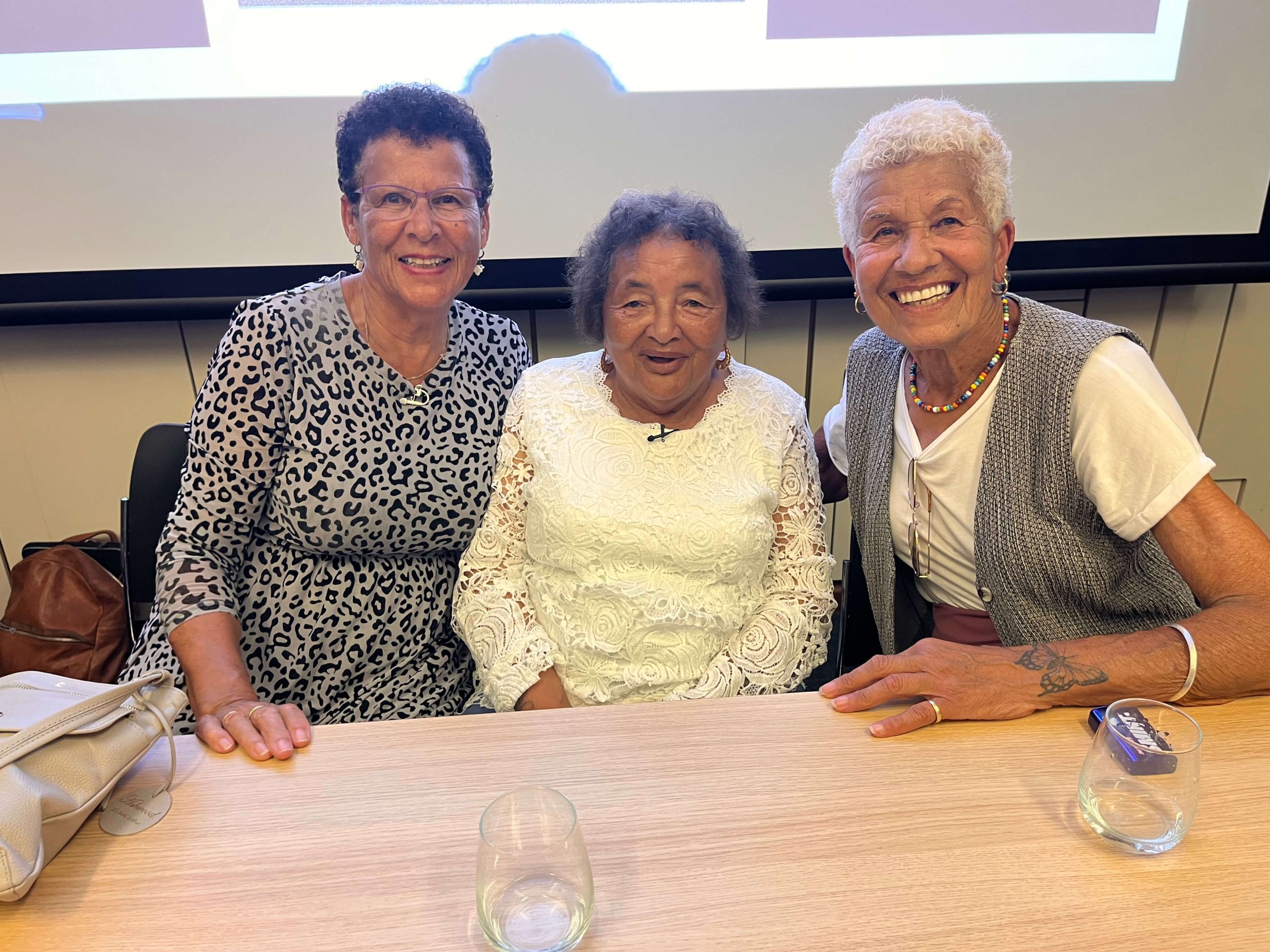 Deborah Carol and Ann at Holnicote House panel From left to right: former residents of Holnicote House, Deborah Prior, Ann Evans and Carol Edwards at the 'Remembering Holnicote House' panel event at the Institute of Historial Research, Senate House, 9 July 2026. Image: The Mixed Museum
