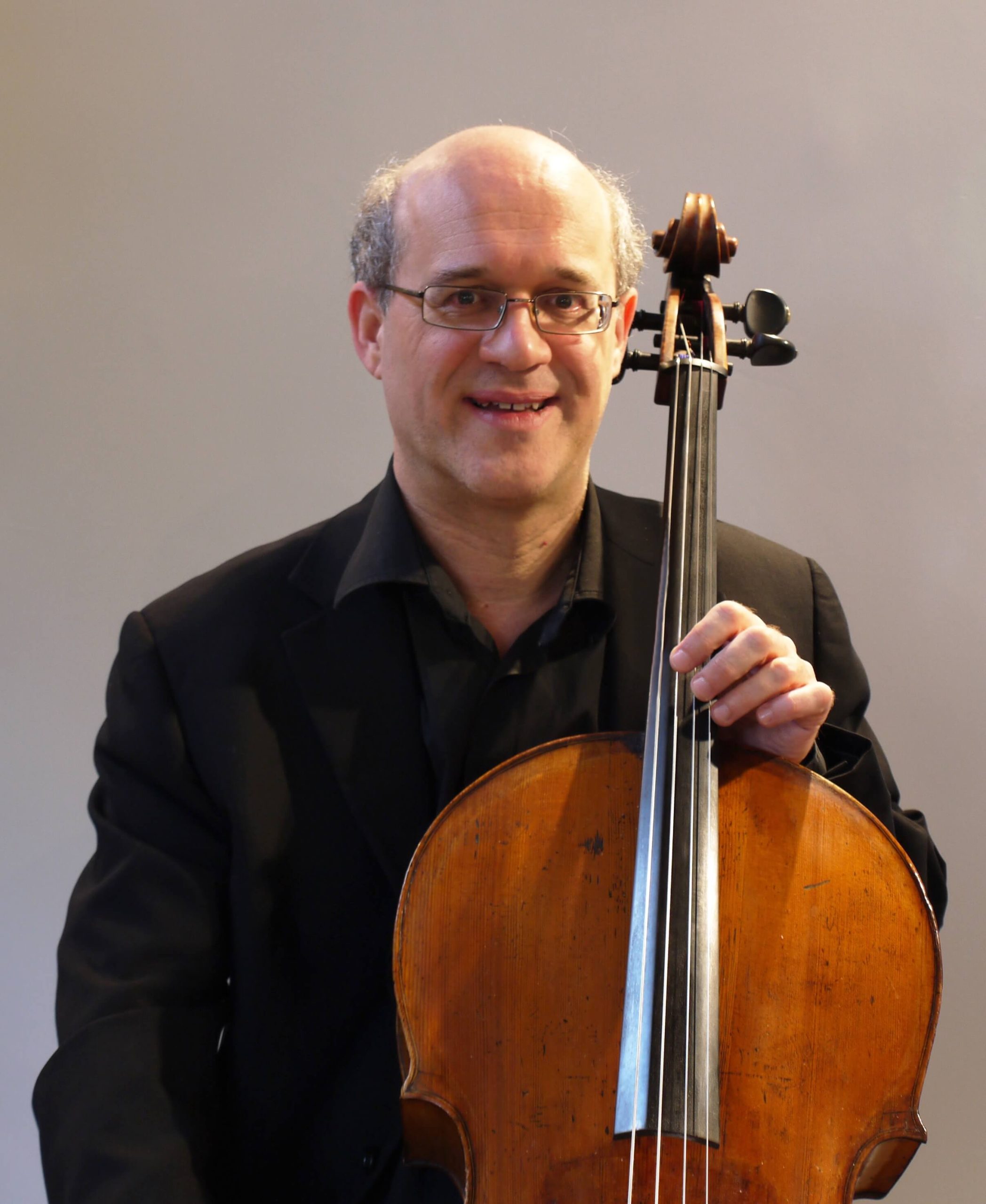 Nick Roberts posing with a cello